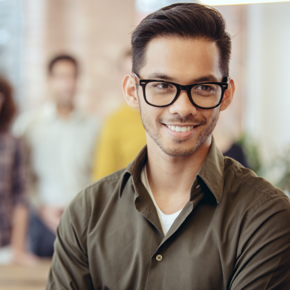 Man with glasses looking off camera