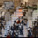 Man with glasses looking at the camera