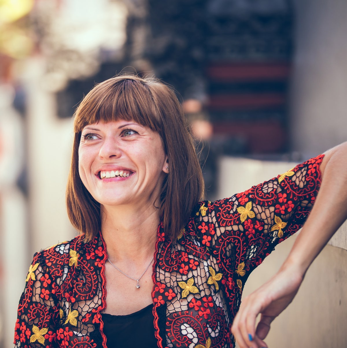 Woman smiling with red top